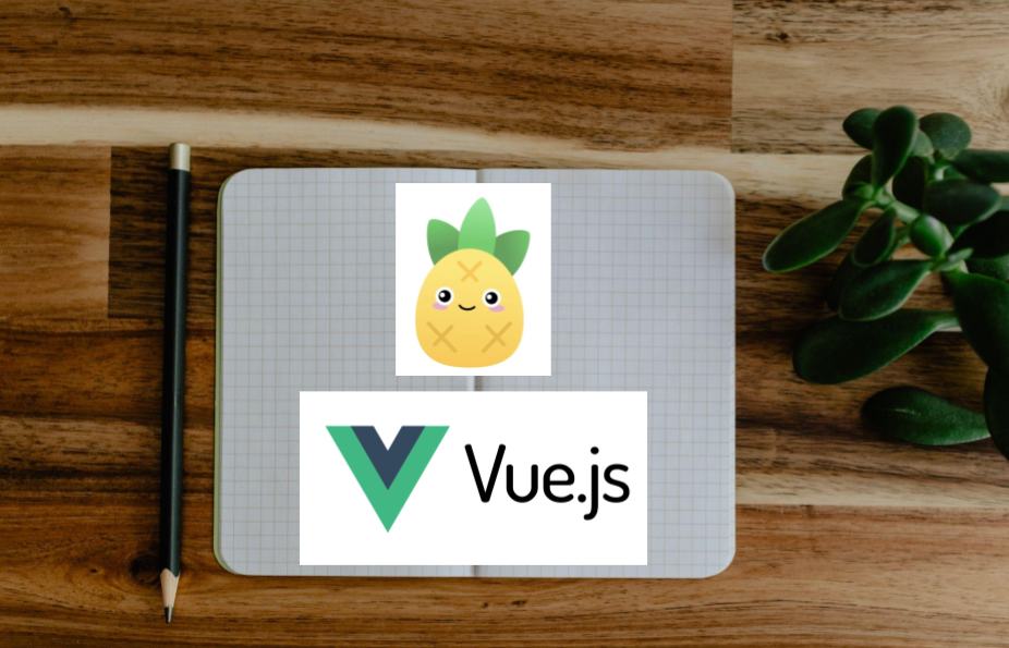 Notebook open with the VueJS and Pinia logos on the notebook.