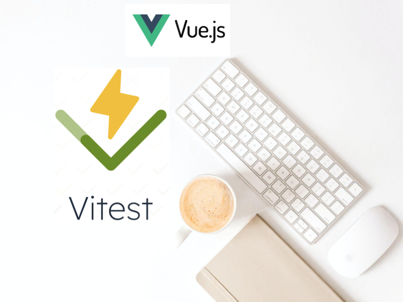 White desktop with the VueJS and Vitest logos on the desk.